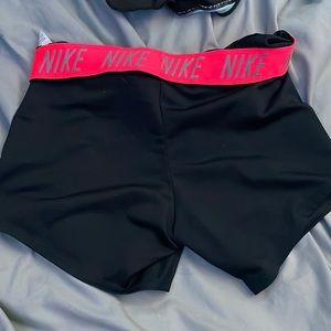 Nike dri-fit shorts with neon pink accent